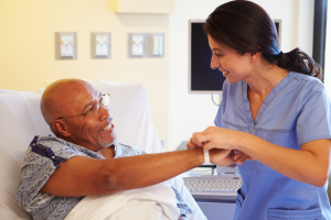 Medical professional looking a patient wristband