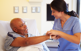 Medical professional looking a patient wristband