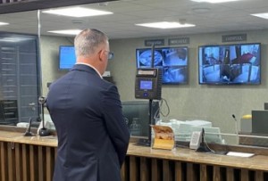 man standing at iris recognition terminal